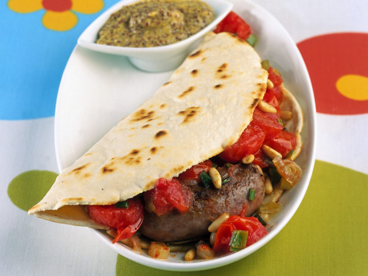 Piadina con salsiccia e pomodorini saltati