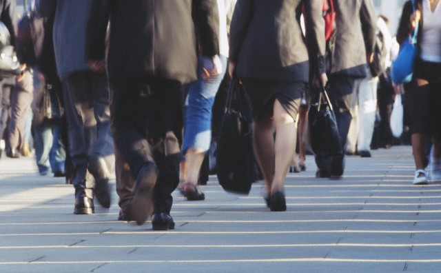 Low section view of a large group of people walking