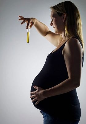 pregnant woman with test tube