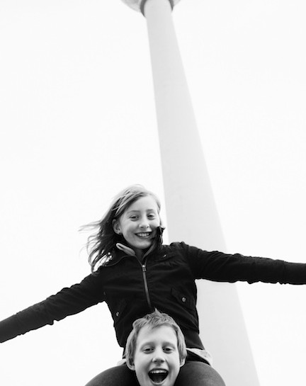 Boy carrying girl on shoulders