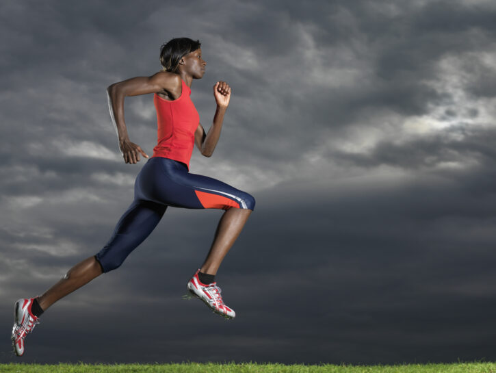 Woman Running Under Stormy Sky