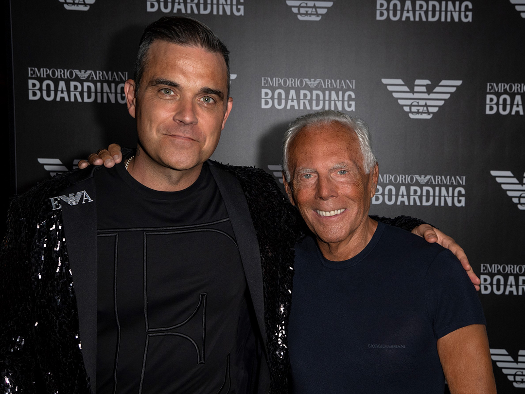 Emporio Armani: la sfilata-evento nell'hangar dell'aeroporto di Linate. Con  Robbie Williams - Donna Moderna