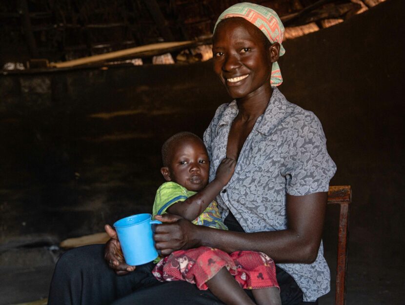 Aloyo with her baby.  She is married and she, like all women, has to take care of procurement