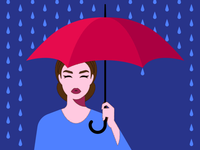 Donna che affronta pioggia con ombrello
