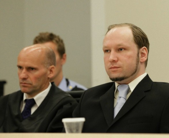 21 Jun 2012, Oslo, Norway --- epa03274824 Confessed mass killer Anders Behring Breivik (right) sits next to his defence lawyer Geir Lippestad moments before prosecutors delivered their closing arguments in the Oslo courthouse 21 June 2012. The prosecutors were widely expected to call the man responsibile for the deaths of 77 people to be declared insane as the 10 week long trial nears its end. Breivik has already admitted his guilt in the bombing and shooting rampage that left 77 people dead on July 22 last year EPA/berit roald NOrway out --- Image by © berit roald/epa/Corbis