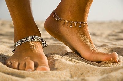 Tobago, Trinidad and Tobago --- Foot and Ankle Bracelet --- Image by © Jack Hollingsworth/Corbis