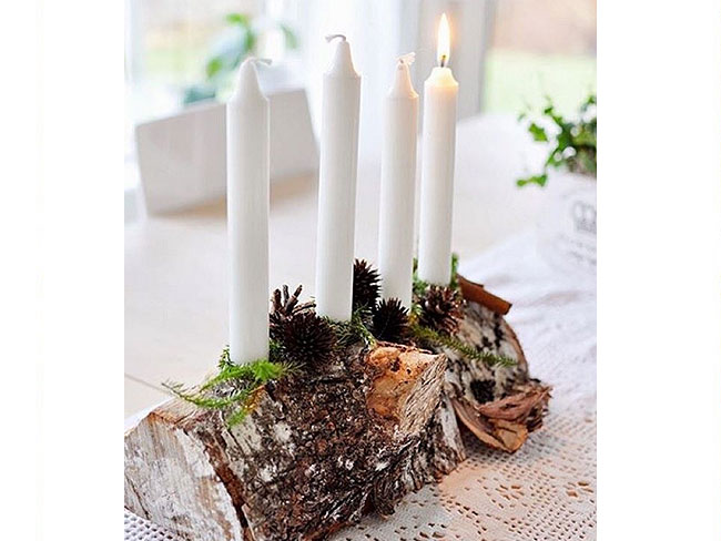 <p> <b>DECORARE CON IL LEGNO</b><br />Il tronco si trasforma in un <b>centrotavola</b> d'eccezione, dove posizionare <b>bacche colorate</b> e <b>candele</b> da accendere durante le festività. Hai trovato un pezzo di legno di forma concava abbastanza grande da scavare? Sfruttalo come fioriera, aggiungendo una piantina al suo interno oppure un soffice tappeto di <b>muschio</b>.</p>