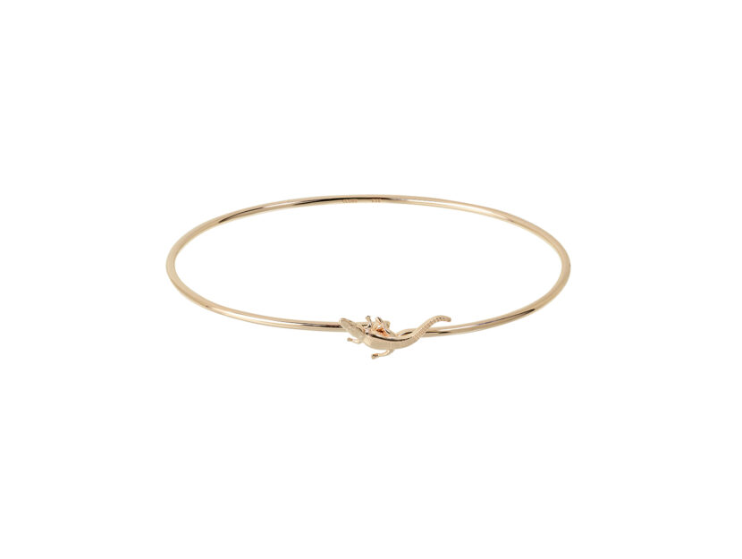 <p>Bracciale rigido in oro con dettaglio sulla chiusura (CLUSE)  </p>